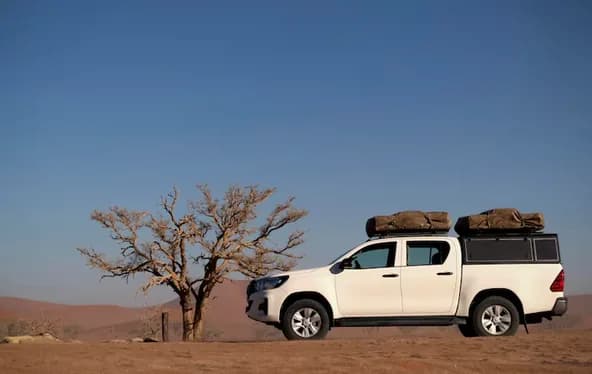 A Toyota Hilux on a desert road, kept running by disciplined maintenance