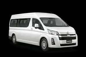 White Toyota Quantum shuttle van